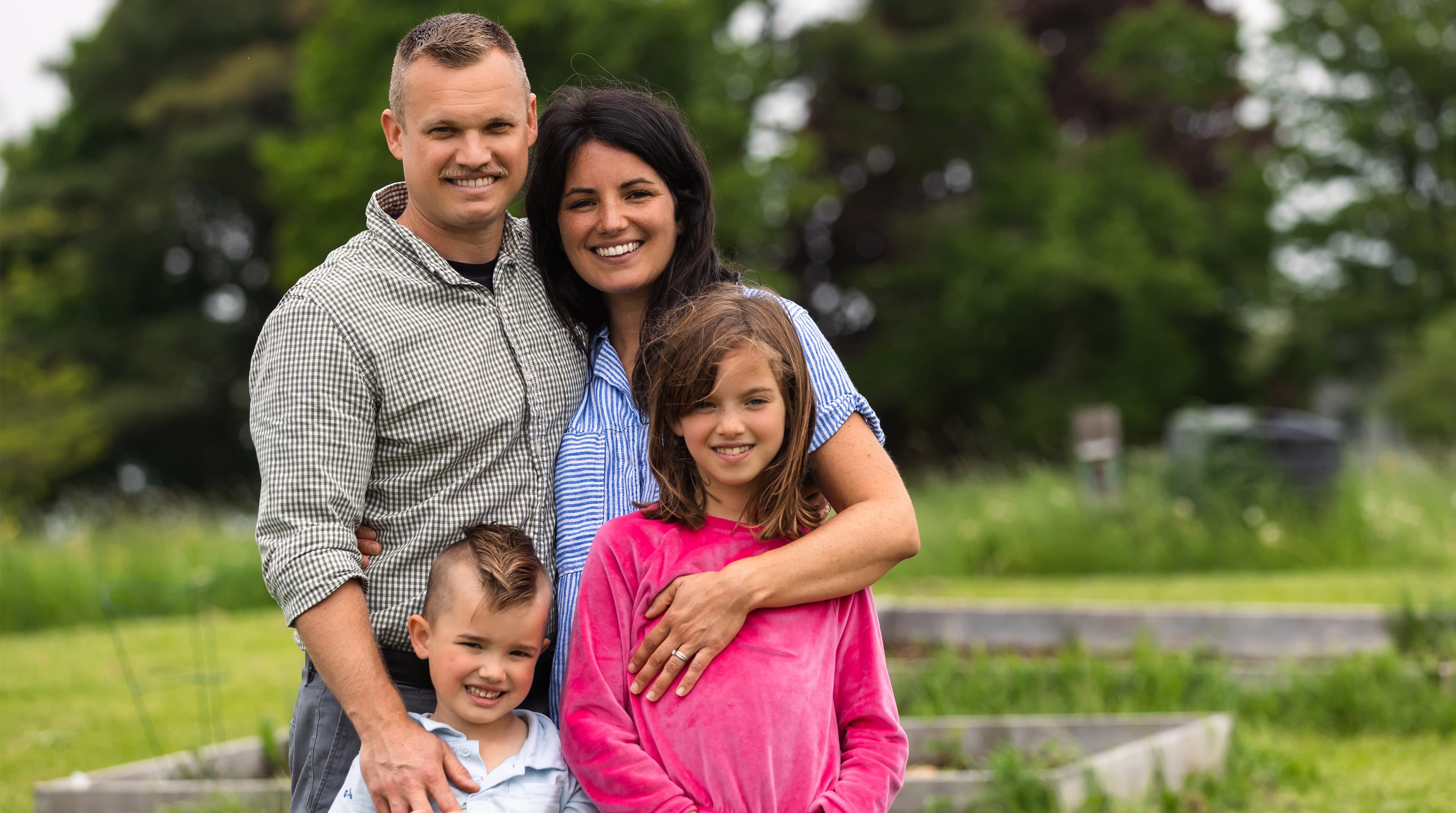 Rachel of Lisbon with her husband and kids in their garden